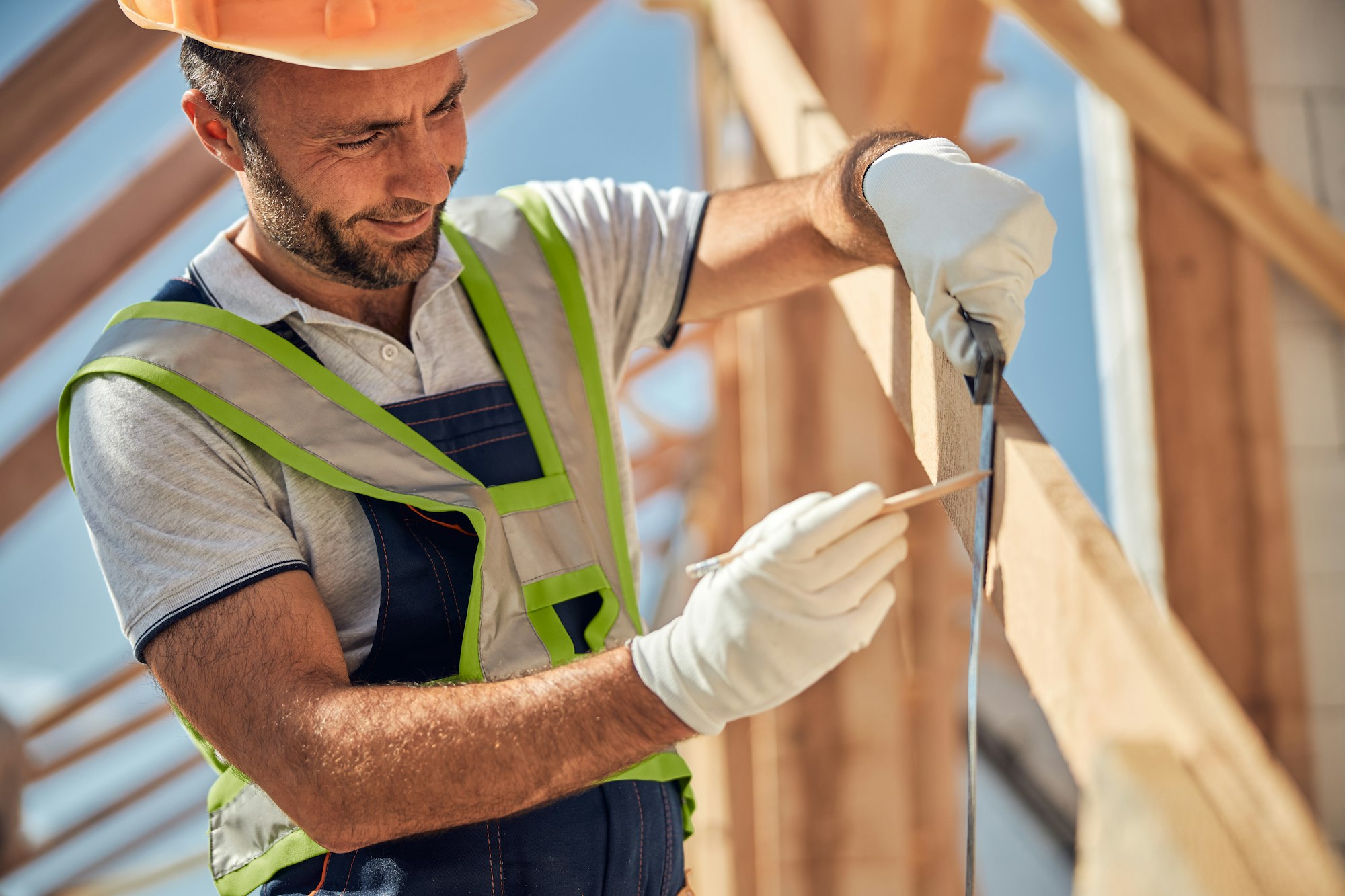 Positive delighted constructor making mark on the beam